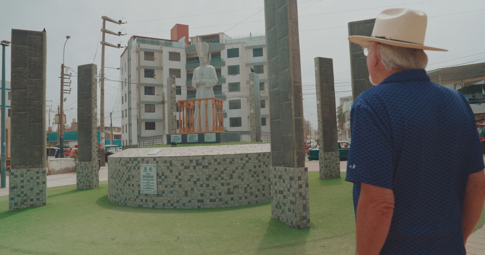 Stan Herd looking at a statue of Pope Leo in Chiclayo