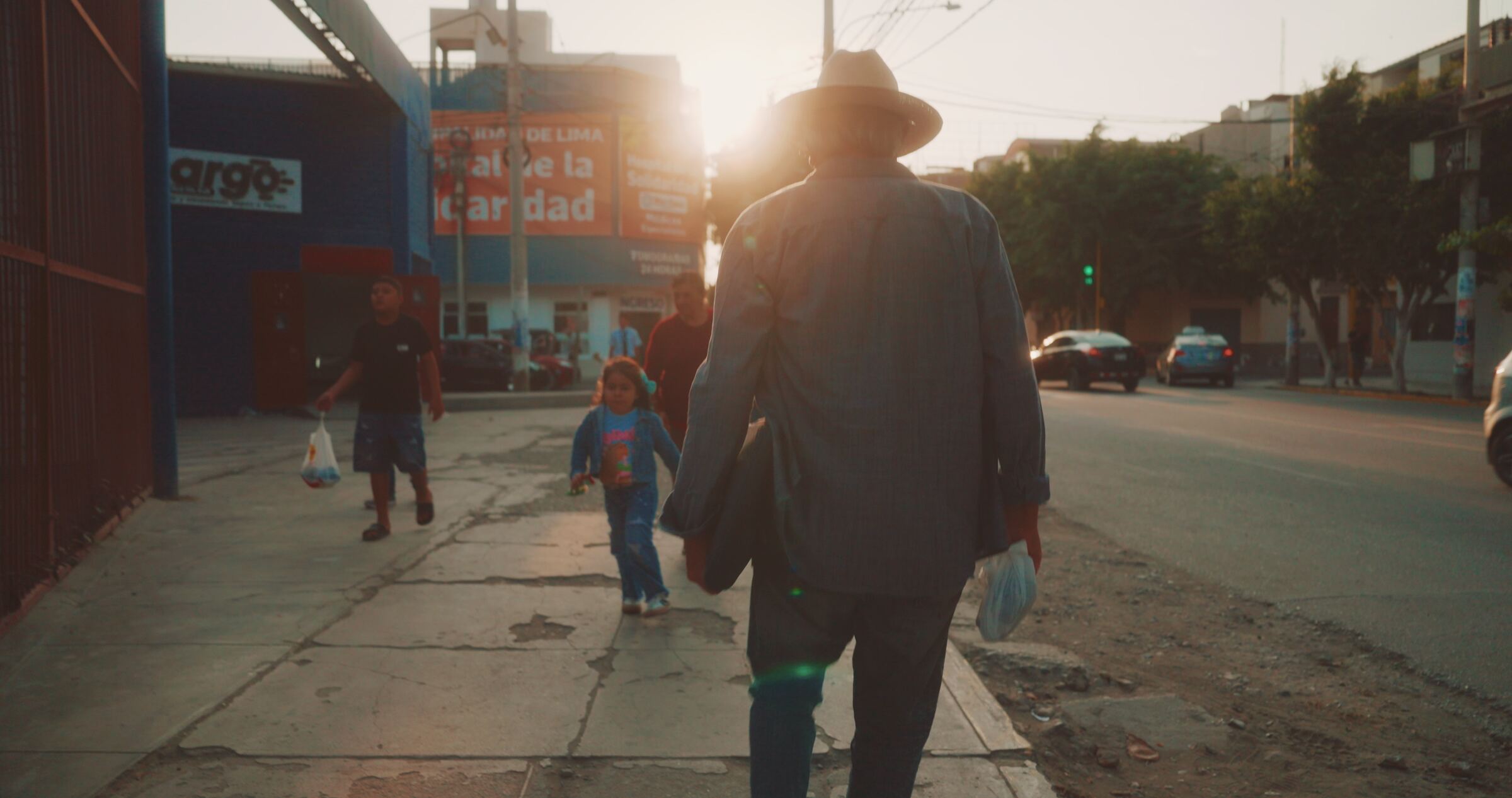 Stan Herd walking a Chiclayo street at sunset