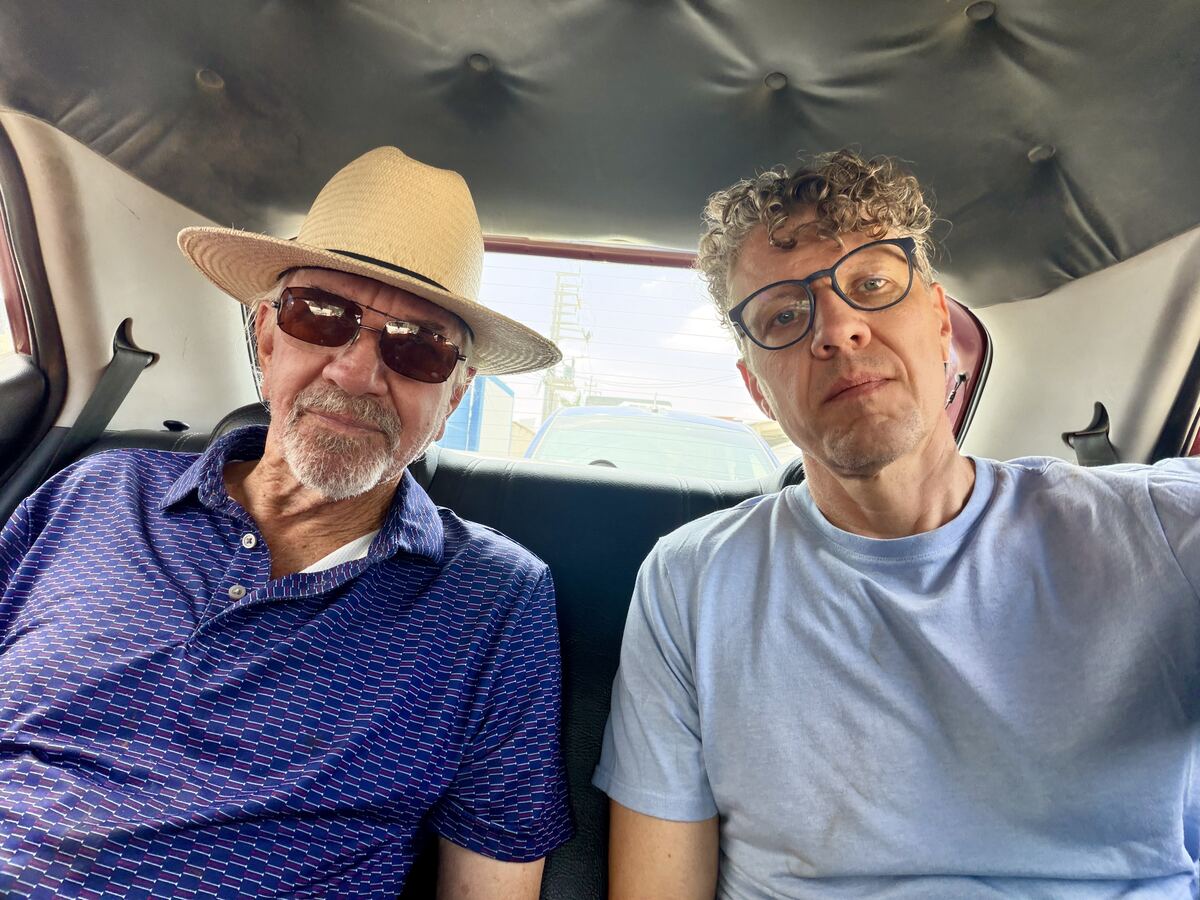 Marc Havener and Stan Herd in the back of a taxi