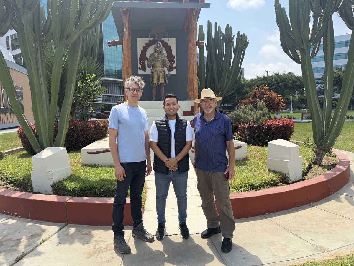 Marc Havener, John and Stan Herd in front of a monument