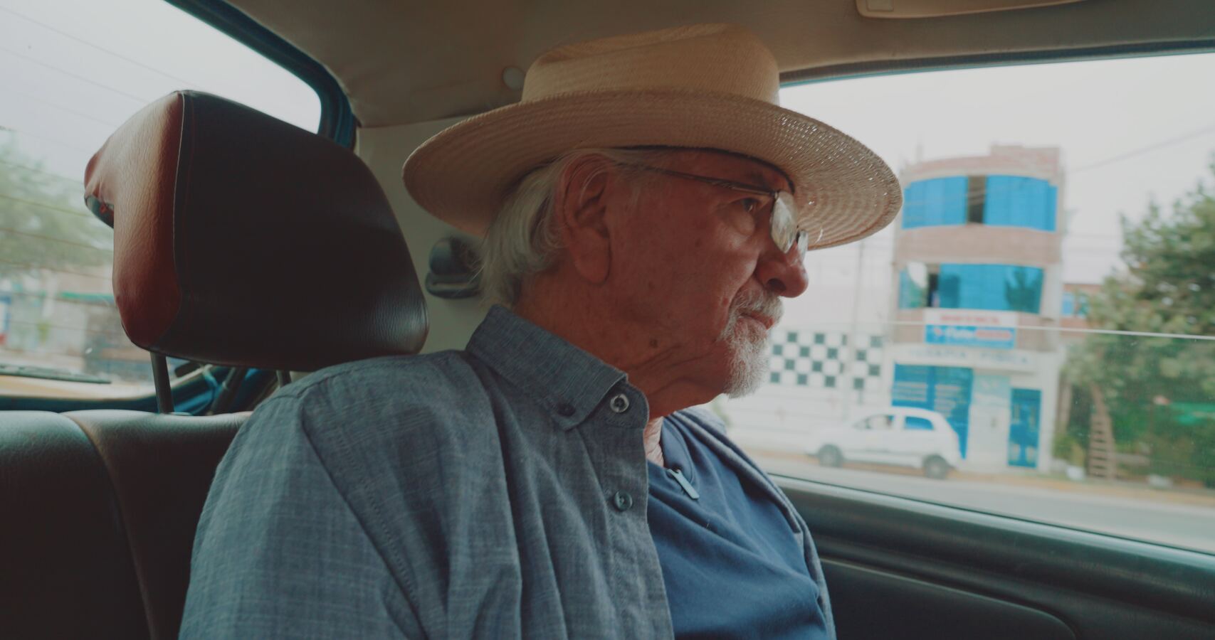 Stan Herd looking out the window of a car